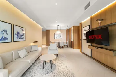 a living room with a couch and a tv at VayK - Exceptional 3BR at Address Dubai Opera in Dubai