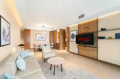 a living room with a couch and a tv at VayK - Exceptional 3BR at Address Dubai Opera in Dubai