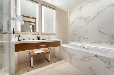 a bathroom with a tub and a sink and a bath tub at VayK - Exceptional 3BR at Address Dubai Opera in Dubai
