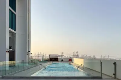 a swimming pool on the side of a building at PVH - Serene 1BR with City View - Binghatti House in Dubai