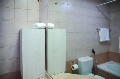 a bathroom with a white toilet and a sink at 1 Bedroom Apartment at Marina with Stunning View in Dubai
