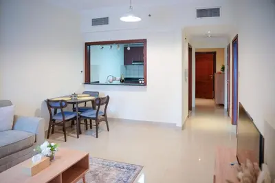 a living room with a couch and a table at 1 Bedroom Apartment at Marina with Stunning View in Dubai