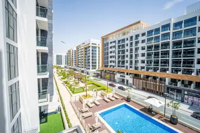 an aerial view of an apartment complex with a swimming pool at AWS Holiday Homes - Comfy Cozy Studio in Dubai