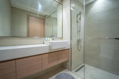 a bathroom with a white sink and a shower at AWS Holiday Homes - Comfy Cozy Studio in Dubai
