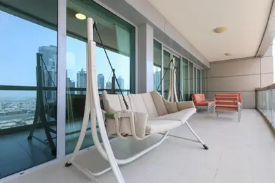a room with a swing in a building at Bright 2BR with Burj, Sea & City Views - Walk to Mall in Dubai