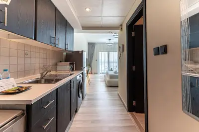 a kitchen with a sink and a counter at HAVN - Studio in Alka, The Greens in Dubai