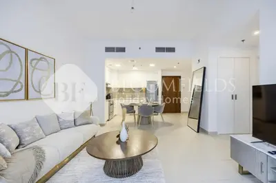 a living room with a couch and a table at Bloomfields Cozy 1br Apt Town Square in Dubai