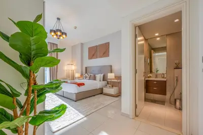 a hotel room with a bed and a bathroom at Chic 1 Bedroom in Business Bay in Dubai