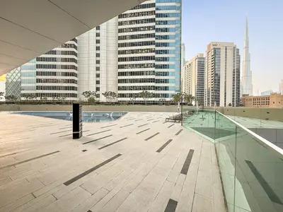 a balcony with a view of a city with tall buildings at FIRST CLASS Studio Marquise Bliss in Dubai