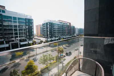 arial view of a city street with tall buildings at Azizi Riviera Modern Studio Near Downtown in Dubai