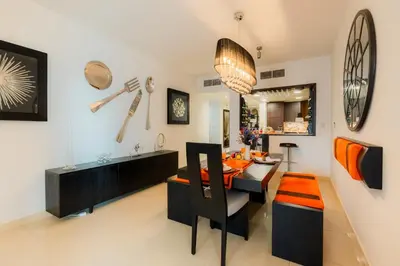 a dining room with a dining table and a dining room at Comfortable - Vibrant - Convenient in Dubai