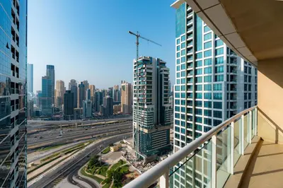 a view of a city from the balcony of a building at Comfortable - Vibrant - Convenient in Dubai