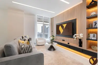 a living room with a couch and a tv at Vogue Marina Dorra Bay near JBR Beach and Ain Dubai, Two Bedroom apartment with Balcony, Canal and Skyline View, Access to all Amenities in Dubai