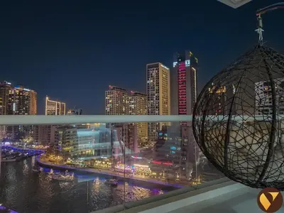 a view of a city skyline at night at Vogue Marina Dorra Bay near JBR Beach and Ain Dubai, Two Bedroom apartment with Balcony, Canal and Skyline View, Access to all Amenities in Dubai