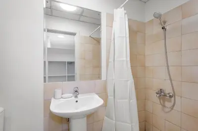 a bathroom with a sink and a shower at Cozy 3 Bedroom with walking access to JBR Beach in Dubai