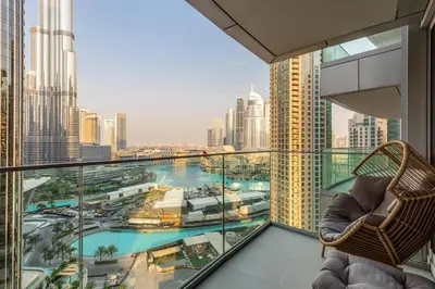 a balcony with a view of a city skyline at Luxury 1st Row Burj Khalifa and Fountain Views, Walk to Dubai Mall in Dubai