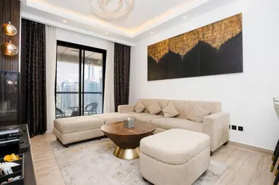 a living room with a couch and a table at CitiHome - Modern & Stylish 1BR in Dubai Marina in Dubai