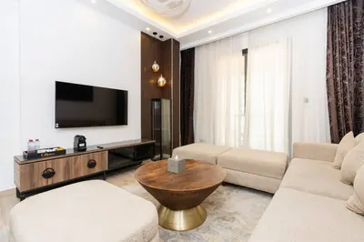 a living room with a couch and a tv at CitiHome - Modern & Stylish 1BR in Dubai Marina in Dubai