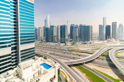 a highway in a city with tall buildings at CitiHome - Modern & Stylish 1BR in Dubai Marina in Dubai