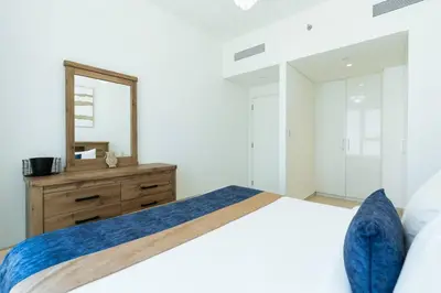 a bedroom with a bed with a mirror and a dresser at CitiHome Luxury 1BR - Downtown Views 2 High Floor in Dubai