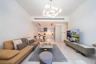 a living room with a couch and a table at Elegant 2 Bed Beach Front Retreat in Dubai