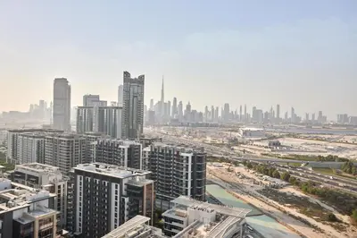 an aerial view of a city with tall buildings at STAY BY LATINEM Luxury 1BR Plus Holiday Home CB 2408 Near Burj Khalifa in Dubai