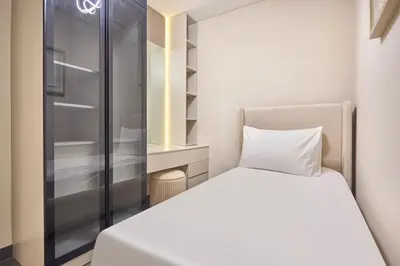 a small bedroom with a bed and a closet at STAY BY LATINEM Luxury 1BR Plus Holiday Home CB 2408 Near Burj Khalifa in Dubai