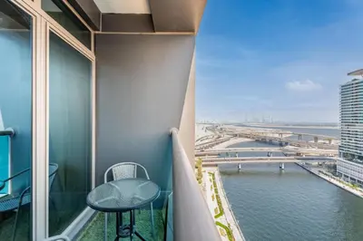 a balcony with a table and a view of the water at GuestReady - Canal View Studio | Near Dubai Mall in Dubai
