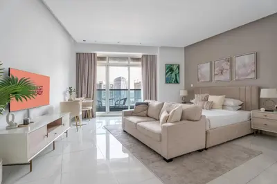 a living room with a bed and a couch at GuestReady - Canal View Studio | Near Dubai Mall in Dubai