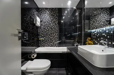 a bathroom with a toilet and a sink and a tub at GuestReady - Canal View Studio | Near Dubai Mall in Dubai