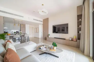 a living room with a couch and a table at Frank Porter - Rahaal 2 in Dubai