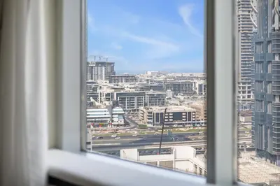 a view of a city from a window at Stunning 2BR in Downtown Partial Burj Khalifa View in Dubai