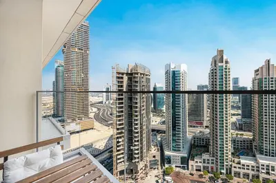 a view of the city from the balcony of a apartment at New LUX 1 BDR apartment in Downtown Dubai in Dubai