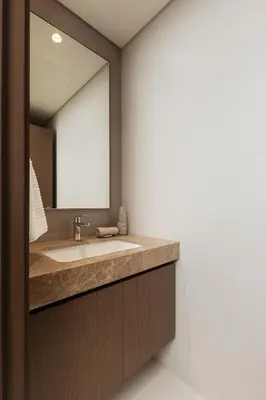 a bathroom with a sink and a mirror at Elegant 2BR Apartment with Sea View in Dubai