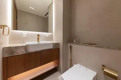 a bathroom with a sink and a mirror at Modern 1BR Apartment with City View in Dubai