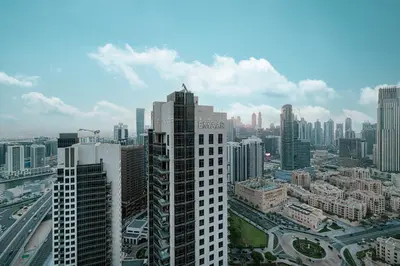 an aerial view of a city with tall buildings at Maison Distinction Suites by Hostiva - Burj and Fountain View in Dubai