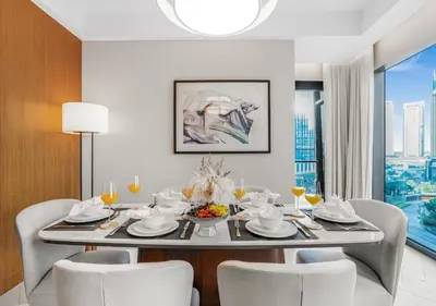 a dining room with a table and chairs at Ultra-Luxury Burj & Fountain Suite at Address Opera in Dubai