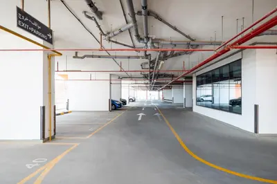 an empty parking lot in a parking garage at Luxury Silicon Oasis Studio Near Mall & Airport in Dubai