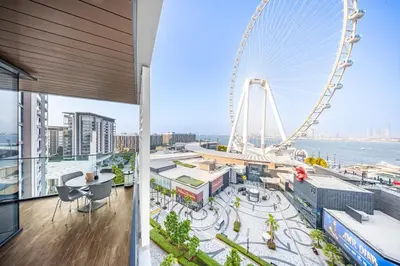 a view of the ferris wheel from the top of a building at 3BR Luxury Stay with Maid Room and Views of Ain Dubai & Sea in Dubai