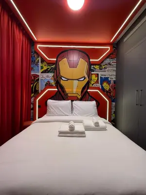 a bedroom with a superhero headboard and a bed at Capsule Super Heroes - Playstation 5 Burj Khalifa View - Near Downtown Dubai in Dubai