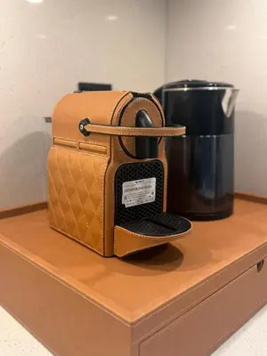 a toaster sitting on a counter next to a coffee pot at Capsule Super Heroes - Playstation 5 Burj Khalifa View - Near Downtown Dubai in Dubai