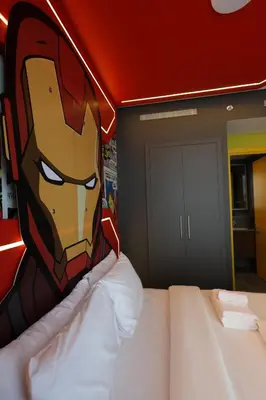 a bedroom with a superhero mural on the wall at Capsule Super Heroes - Playstation 5 Burj Khalifa View - Near Downtown Dubai in Dubai
