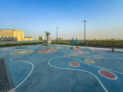 a park with a playground with swings at Chic Living 1 bedroom near Dubai Hills Mall in Dubai