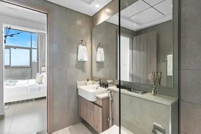 a bathroom with a sink and a mirror at Chic Living 1 bedroom near Dubai Hills Mall in Dubai