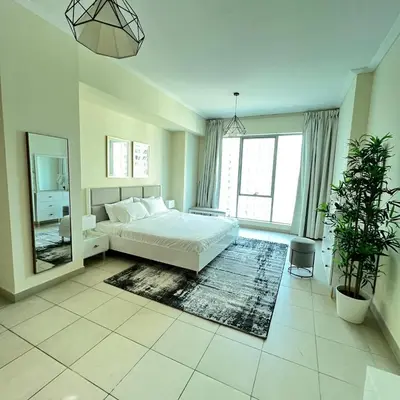 a large bedroom with a bed and a mirror at 1 BR Apartment in Dubai Marina - Paloma Tower - Sea View - 3 Mins away from Tram & Beach in Dubai
