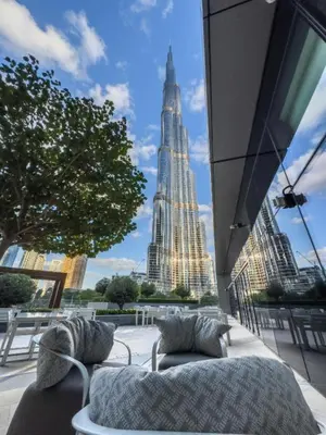 a room with a view of the empire state building at Burj Khalifa & Fountain Sky Suite on The Address Opera in Dubai