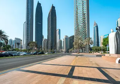 a street in a city with tall buildings at Burj Khalifa & Fountain Sky Suite on The Address Opera in Dubai