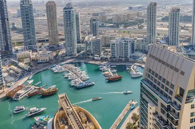 a view of a river with boats in a city at Modern 2 BDR Apartment with Sea View Shams 1 JBR in Dubai