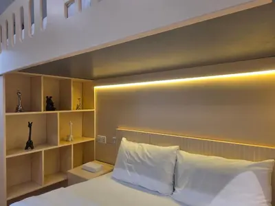 a bedroom with a large bed with white pillows at Stylish JBR Studio Beach View EB in Dubai