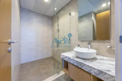 a bathroom with a white sink and a shower at Aspin 2BHK- Stay in the heart of Dubai- 45th floor in Dubai